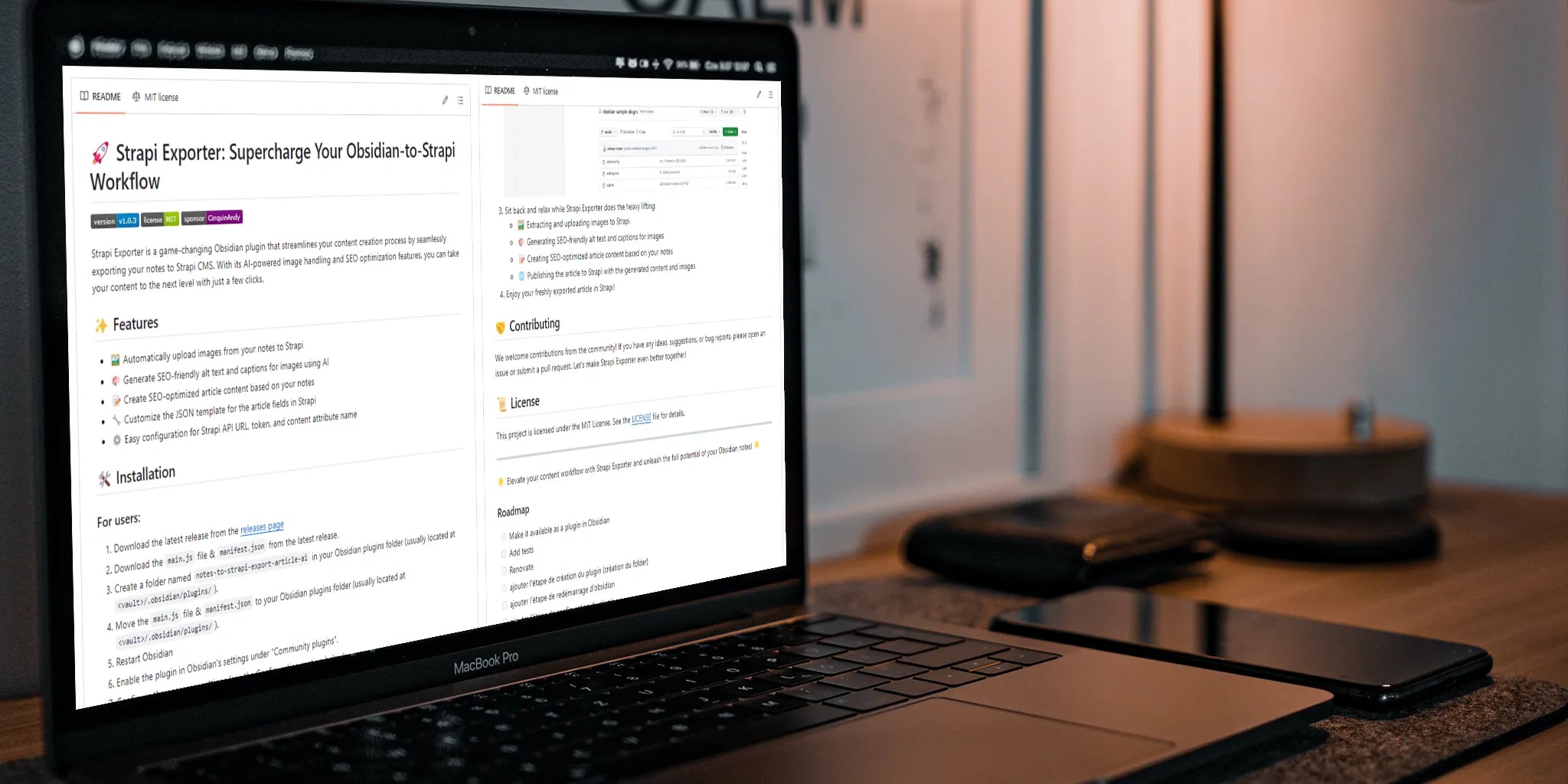 Close-up view of open laptop displaying Strapi Exporter documentation on wooden desk with smartphone and table lamp